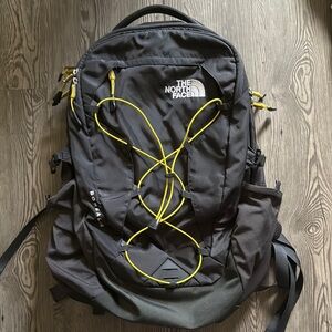 The North Face Black Backpack with Yellow Accents